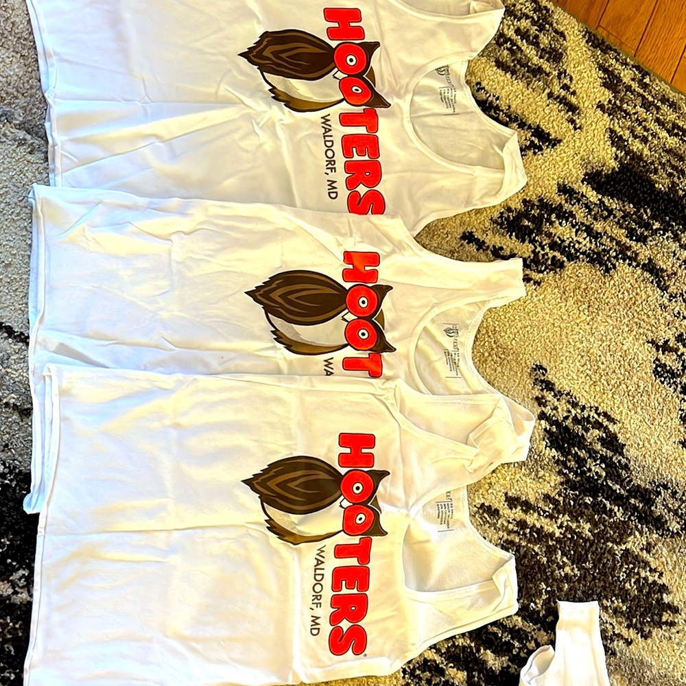 Hooters uniform. Price is for one. Not faded, each worn once. Each size xxs